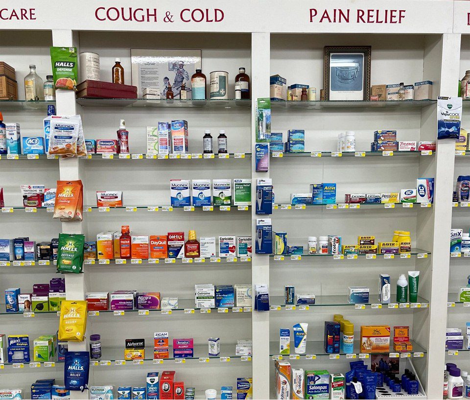 A store with many shelves of medicine and other items.